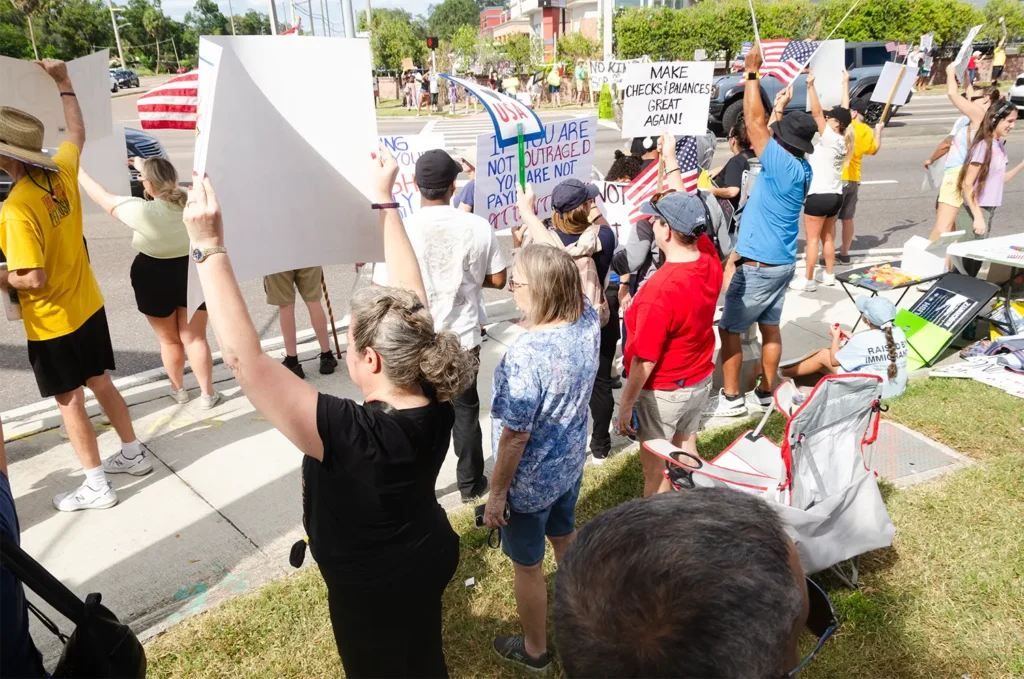 Rally goers and signs