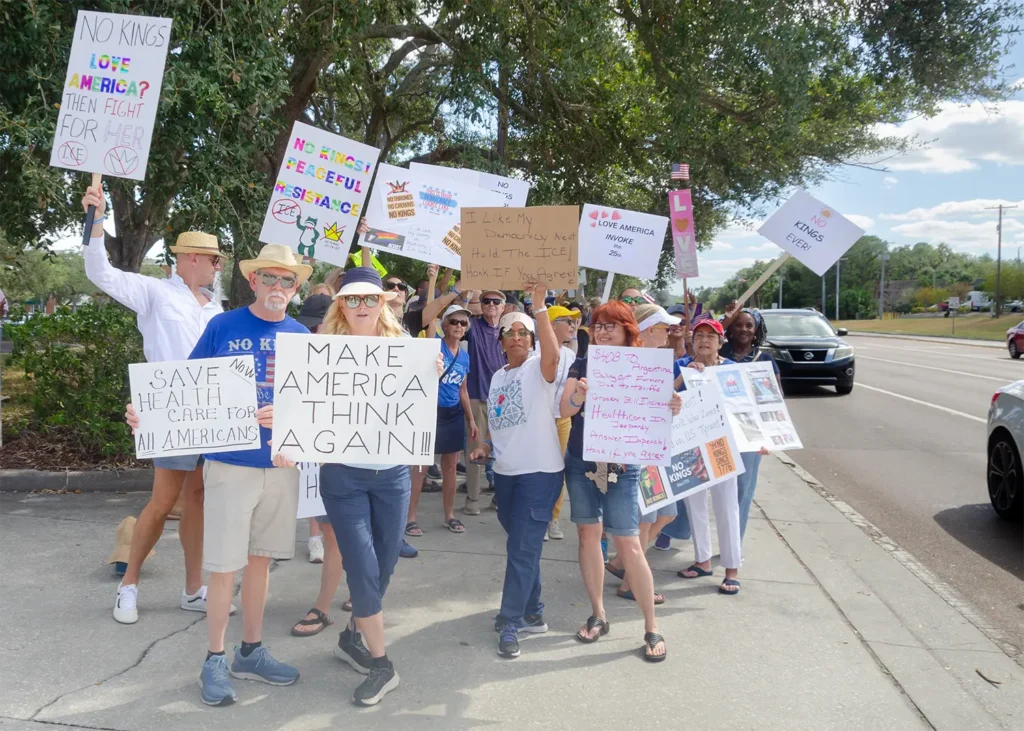 Rally goers and No Kings sign, Make America Think Again